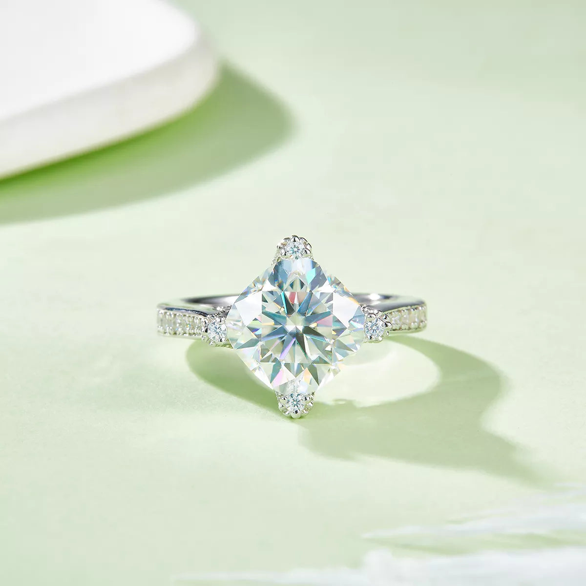 Diamond ring on a light green background